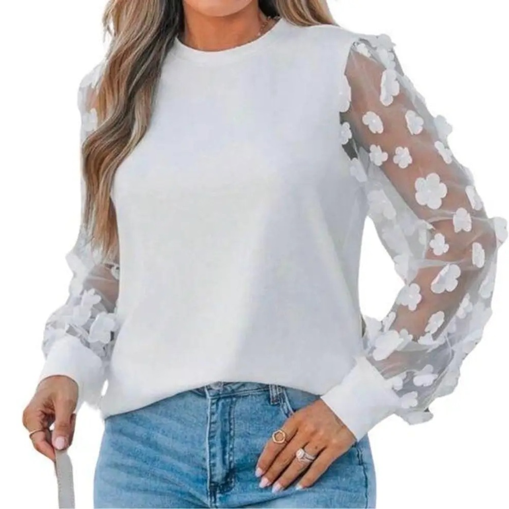 White sweater with sheer floral detail sleeves